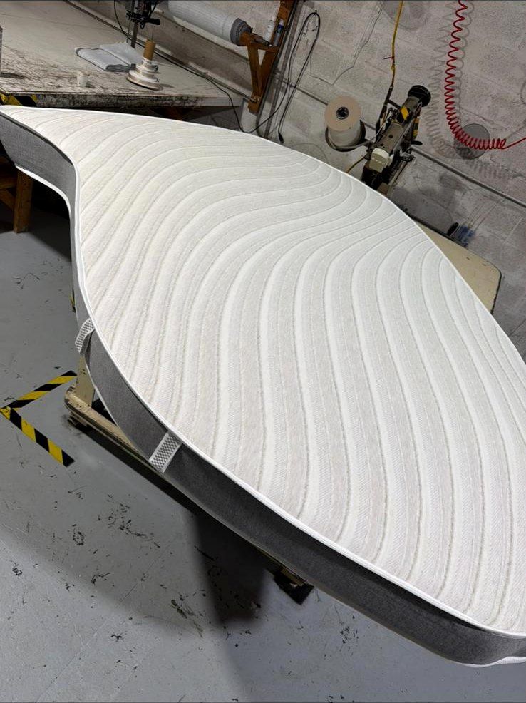 Boat mattress cut to shape on the workshop table