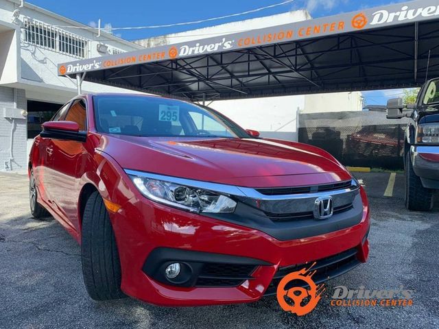 Red Honda Civic finished at the shop