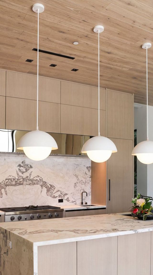 Marble waterfall island in a modern kitchen